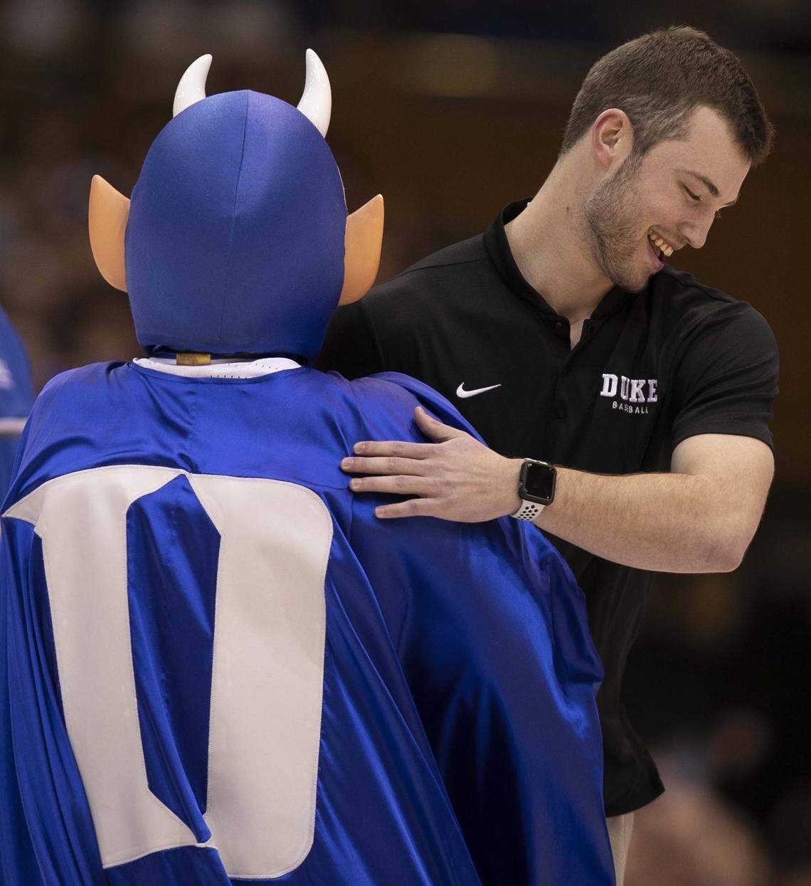Duke pitcher Bryce Jarvis, who pitched a no-hitter yesterday against Cornell, embraces the Blue Devil mascot as he recognized during the Duke vs Virginia Tech game on Saturday, February 22, 2020 at Cameron Indoor Stadium in Durham, N.C.