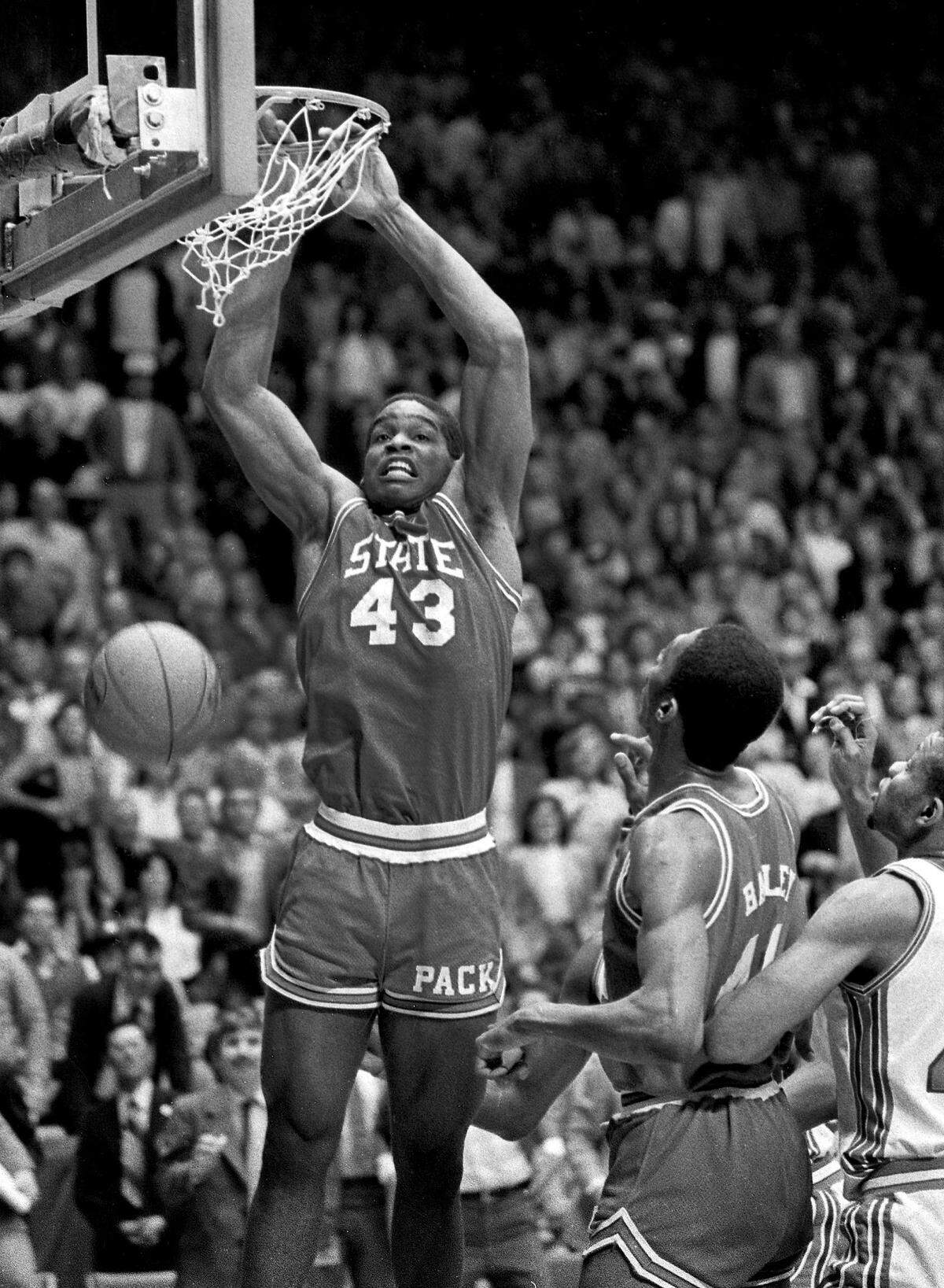North Carolina State’s Lorenzo Charles (43) dunks the ball in the basket to give N.C. State a 54-52 win over Houston in the NCAA Championship game in Albuquerque, N.M., Monday, April 4, 1983.