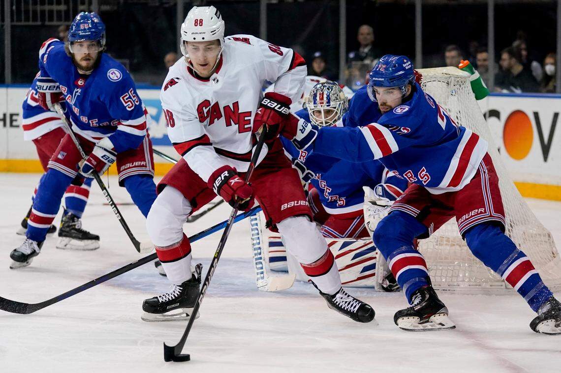 Carolina Hurricanes center Martin Necas (88) sets up for a shot on goal against New York Rangers center Filip Chytil (72) in the first period of Game 4 of an NHL hockey Stanley Cup second-round playoff series, Tuesday, May 24, 2022, in New York. (AP Photo/John Minchillo)