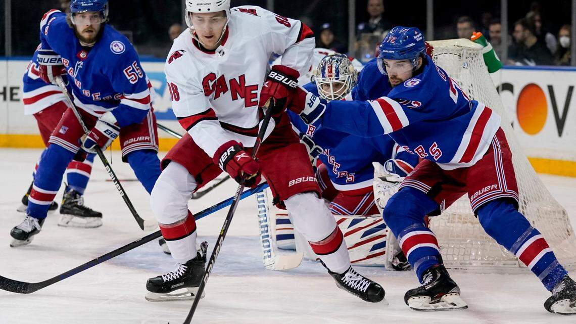 Carolina Hurricanes center Martin Necas (88) sets up for a shot on goal against New York Rangers center Filip Chytil (72) in the first period of Game 4 of an NHL hockey Stanley Cup second-round playoff series, Tuesday, May 24, 2022, in New York. (AP Photo/John Minchillo)