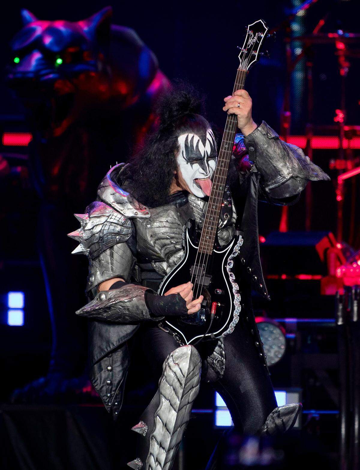 Gene Simmons licks the neck of his guitar as KISS opens their End of the Road World Tour show with “Detroit Rock City” in Raleigh, N.C.’s Coastal Credit Union Music Park at Walnut Creek, Tuesday night, May 17, 2022.