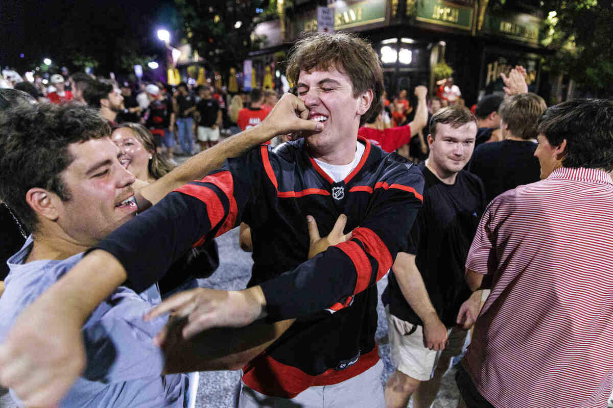 Fans roughhoused with one another as they celebrated in the streets after the Carolina Hurricanes won their second Stanley Cup in Glenwood South District on June 14, 2026, in Raleigh, North Carolina. The Hurricanes last won the Stanley Cup in 2006.