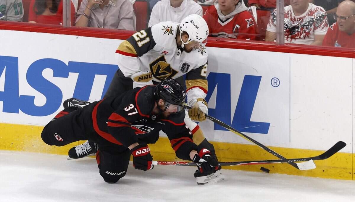 Carolina's Andrei Svechnikov (37) battles Vegas’ Brett Howden (21) for the puck in the third period of the Hurricanes’ 4-2 victory over the Golden Knights in the fifth game of the Stanley Cup Final at the Lenovo Center in Raleigh, N.C., Thursday, June 11, 2026.