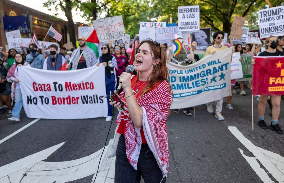 Nicole Bracluk leads the chants as demonstrators march along Blount Street and through the streets of downtown calling for immigration reform during the ‘Ice out of Raleigh’ march on Wednesday, June 11, 2025 in Raleigh, N.C.