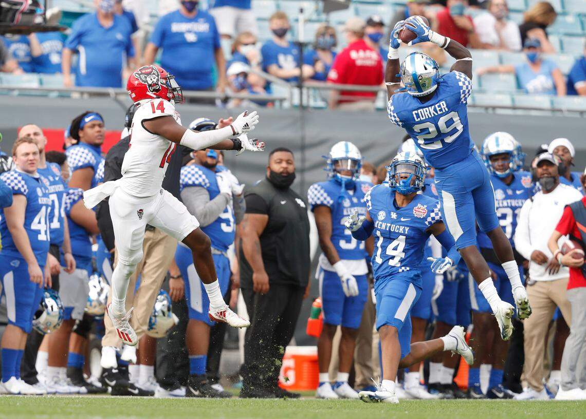 Kentucky defensive back Yusuf Corker (29) intercepts a pass intended for N.C. State wide receiver Porter Rooks (14) during the second half of Kentucky’s 23-21 victory over N.C. State in the Gator Bowl at TIAA Bank Field in Jacksonville, Fla., Saturday, January 2, 2021.