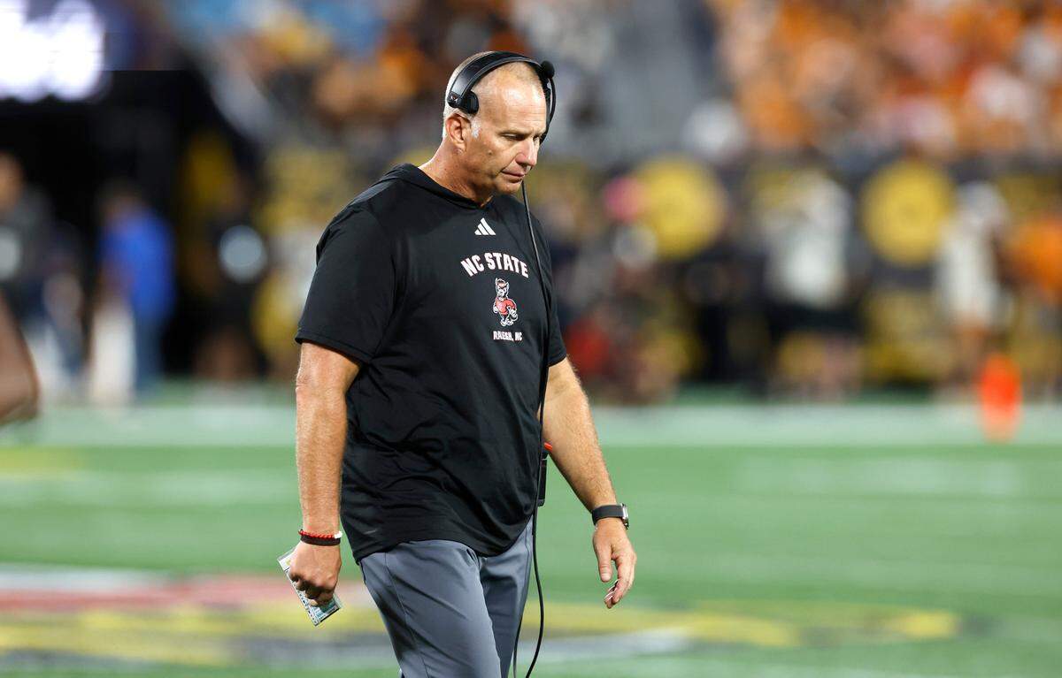 N.C. State head coach Dave Doeren walks back to the sideline during a timeout in the second half of Tennessee’s 51-10 victory over N.C. State in the Duke’s Mayo Classic at Bank of America Stadium in Charlotte, N.C., Saturday, Sept. 7, 2024.