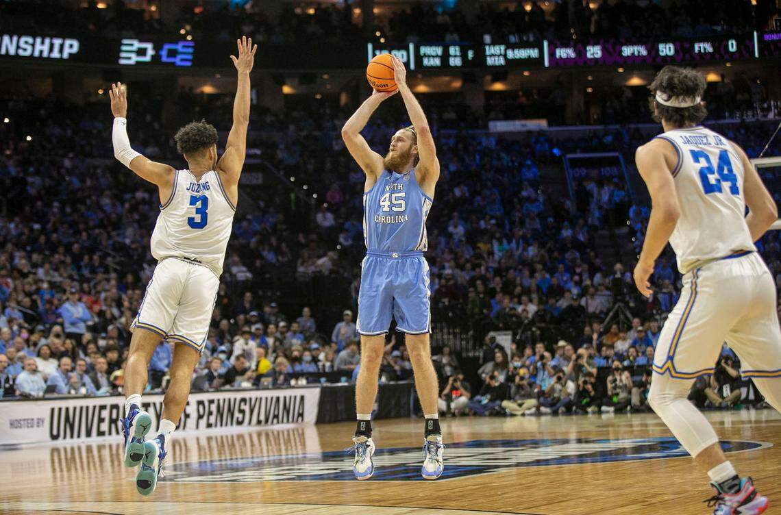 North Carolina’s Brady Manek (45) launches a three-point shot over UCLA’s Johnny Juzang (3) in the first half on Friday, March 25, 2022 during the NCAA East Regional semi-final at Wells Fargo Center in Philadelphia, Pa.