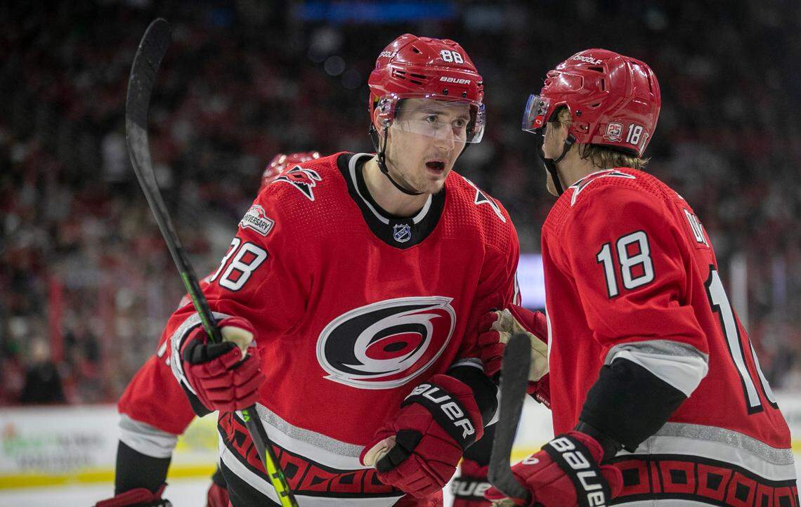 The Carolina Hurricanes Martin Necas (88) confers with teammate Jack Drury (18) in the first period agains the New Jersey Devils during Game 5 of their second round Stanley Cup playoff series on Thursday, May 11, 2023 at PNC Arena in Raleigh, N.C.