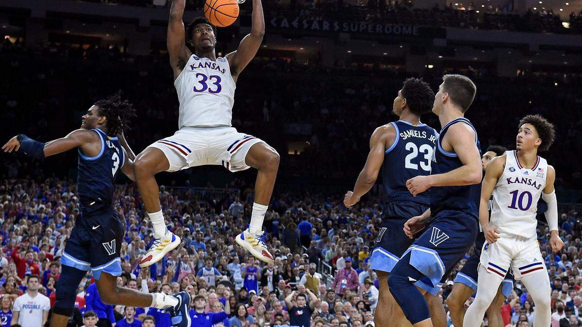 KU’s David McCormack throws down a dunk over Villanova’s Brandon Slater during the second half of Saturday’s NCAA national semifinal at the Final Four at the Superdome in New Orleans. KU breat Villanova, 81-65.