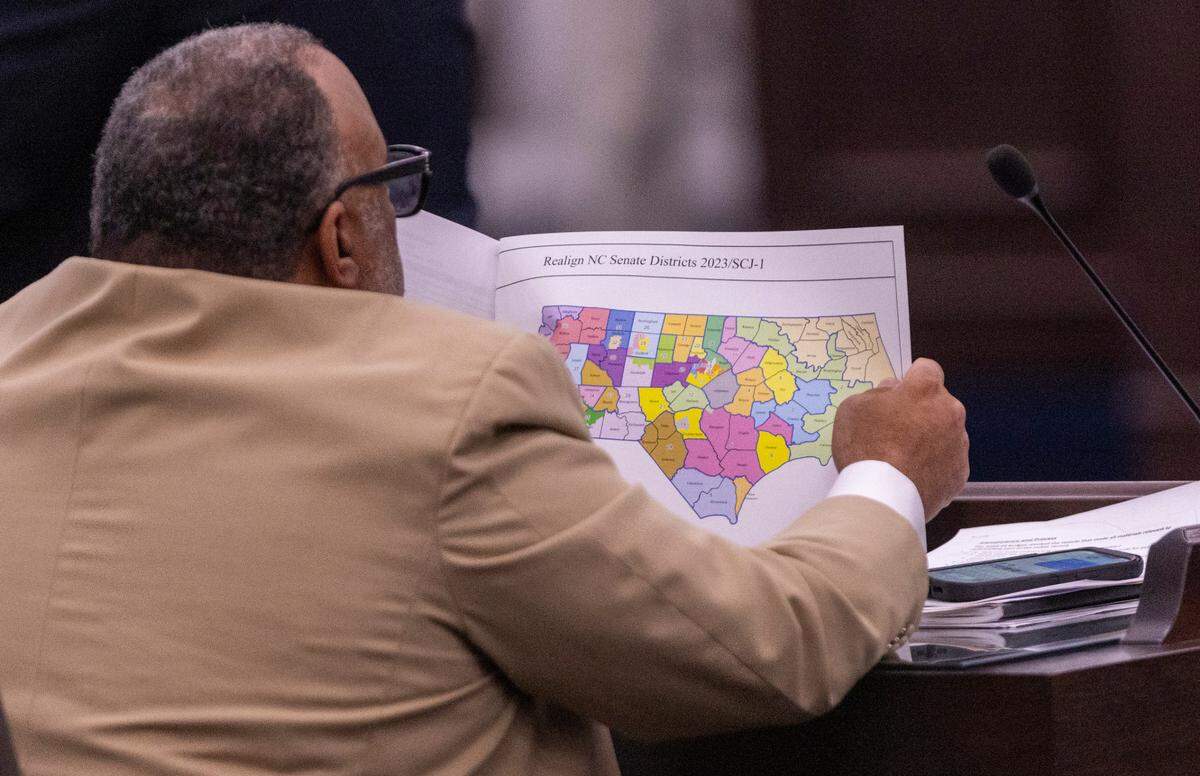 North Carolina state Sen. Paul Lowe, a Forsyth County Democrat, looks at a proposed congressional map during a Senate Committee on Redistricting and Elections meeting at the Legislative Office Building in Raleigh, Thursday, October. 19, 2023.