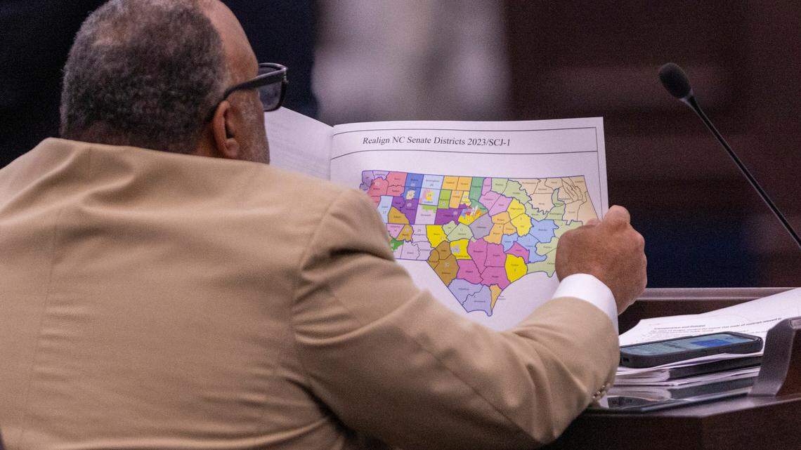 North Carolina state Sen. Paul Lowe, a Forsyth County Democrat, looks at a proposed map of districts during a Senate Committee on Redistricting and Elections meeting at the Legislative Office Building in Raleigh, Thursday, October 19, 2023.