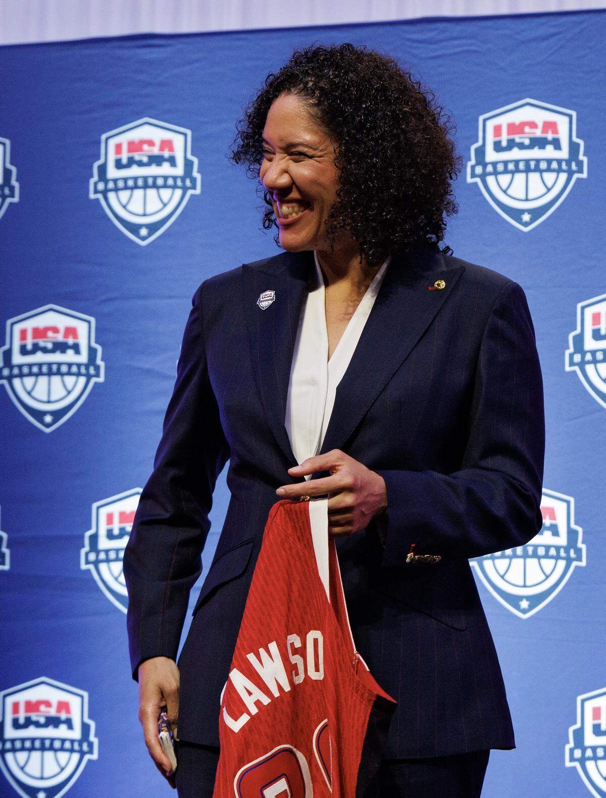 Duke women’s basketball head coach Kara Lawson smiles after being named the 2025-2028 USA Basketball Women’s National Team head coach during a ceremony at Cameron Indoor Stadium on Tuesday, Sept. 23, 2025, in Durham, N.C.