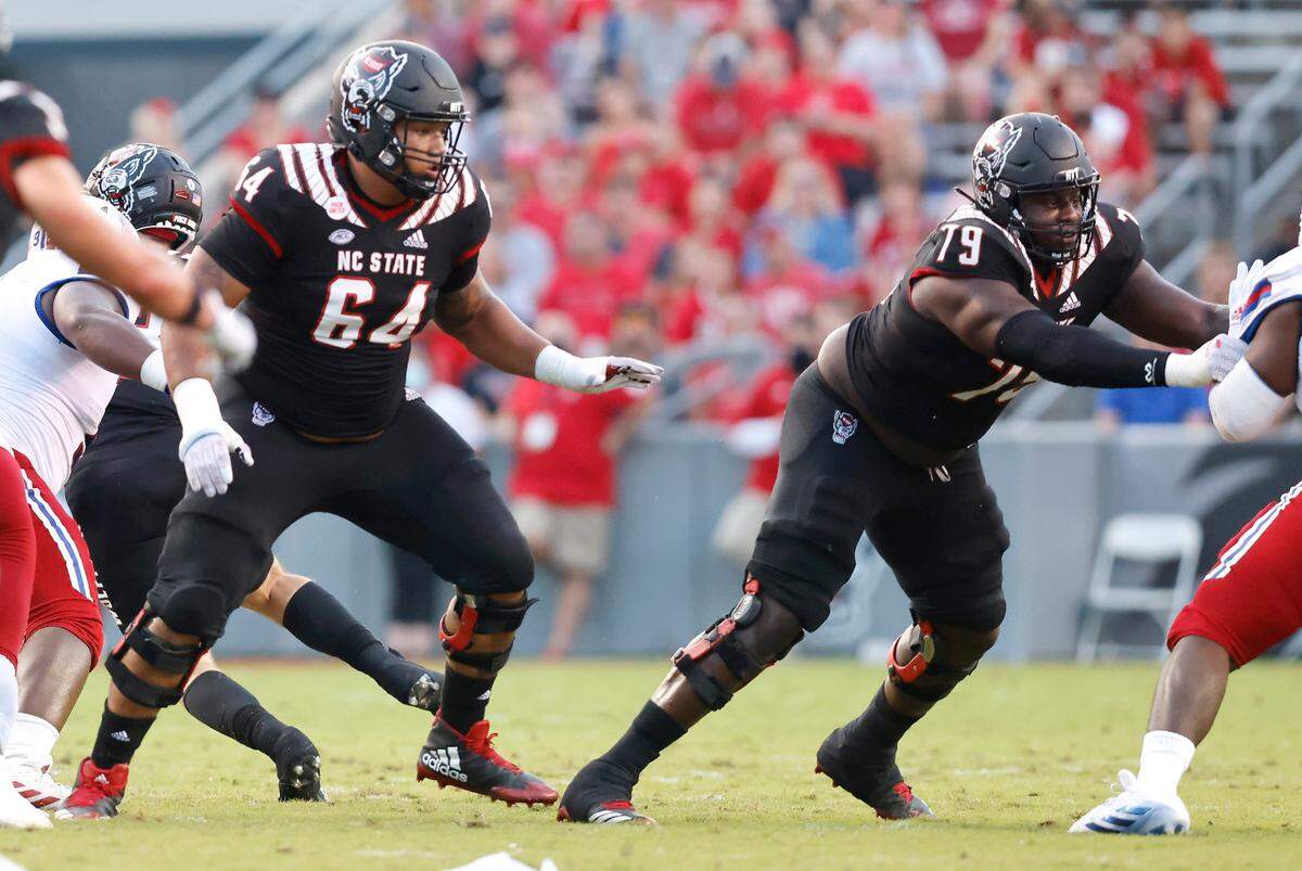 N.C. State offensive linemen Chandler Zavala (64) and Ikem Ekwonu (79) provide blocking during the Wolfpack’s game against Louisiana Tech at Carter-Finley Stadium in Raleigh, N.C., Saturday, October 2, 2021.