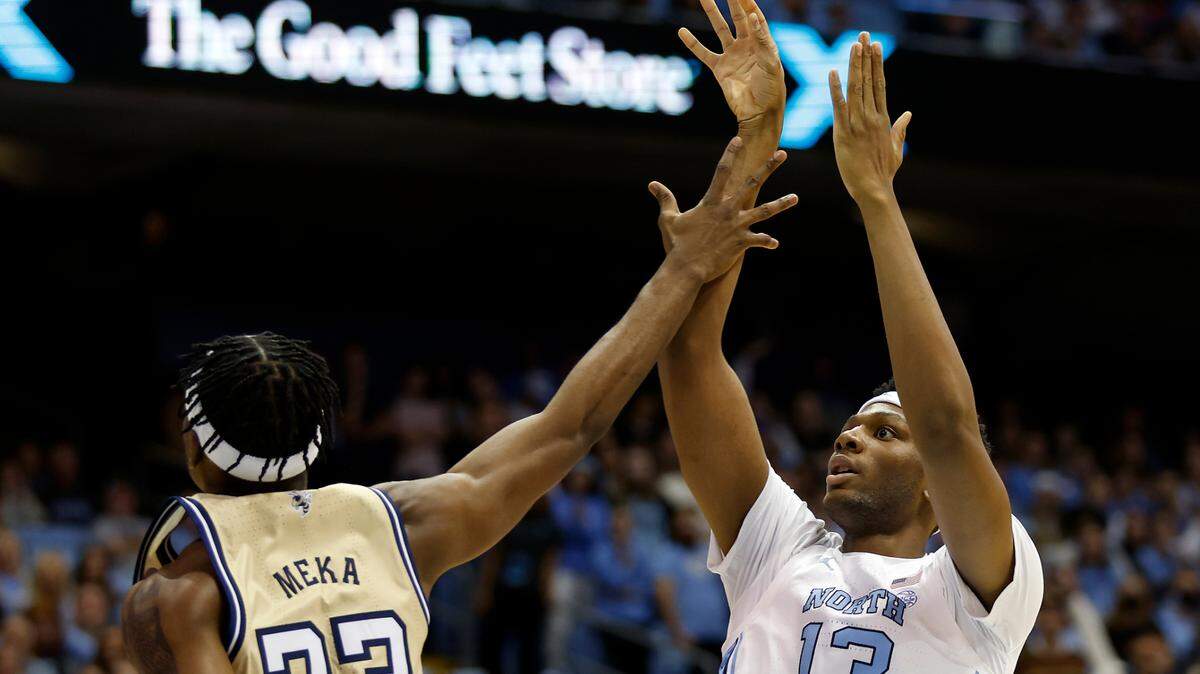 North Carolina’s Jalen Washington shoots over Georgia Tech’s Jordan Meka during the second half of a men’s basketball game at the Dean E. Smith Center on Saturday, Dec. 10, 2022, in Chapel Hill, N.C.