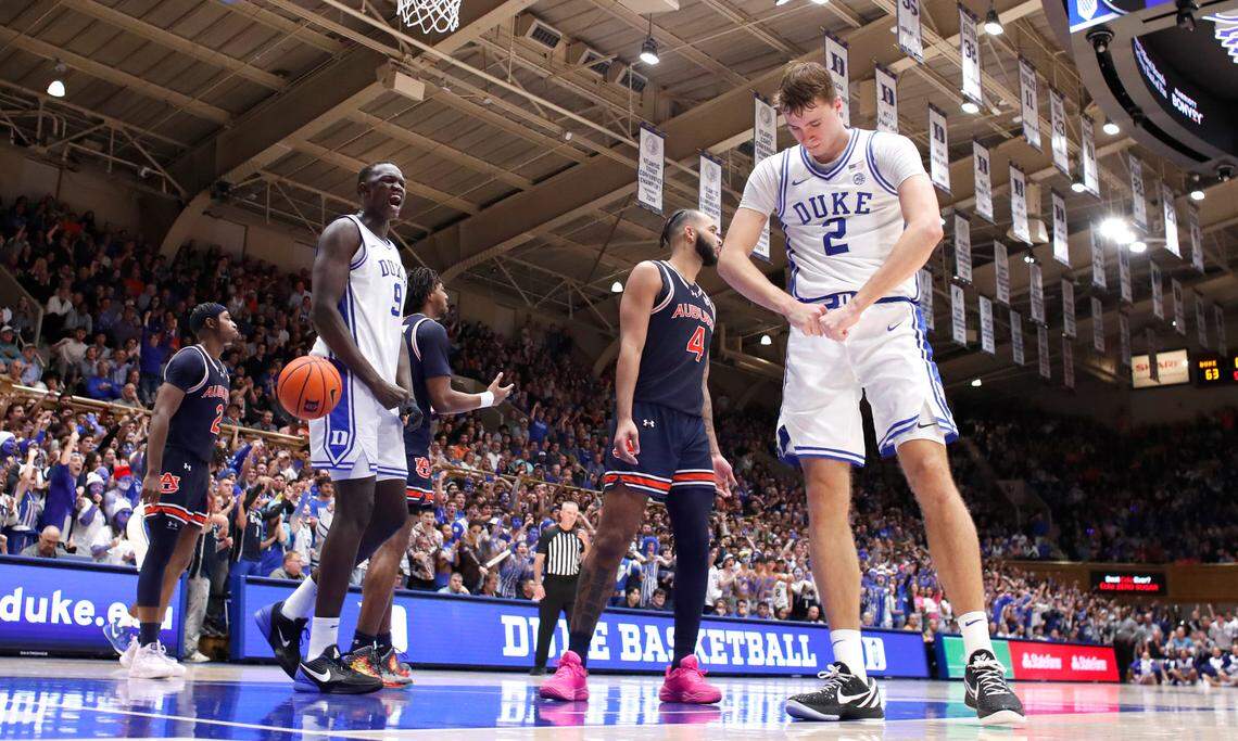 Duke’s Cooper Flagg (2) and Khaman Maluach (9) celebrate after Flagg made the basket while being fouled during Duke’s 84-78 victory over Auburn at Cameron Indoor Stadium in Durham, N.C., Wednesday, Dec. 4, 2024.