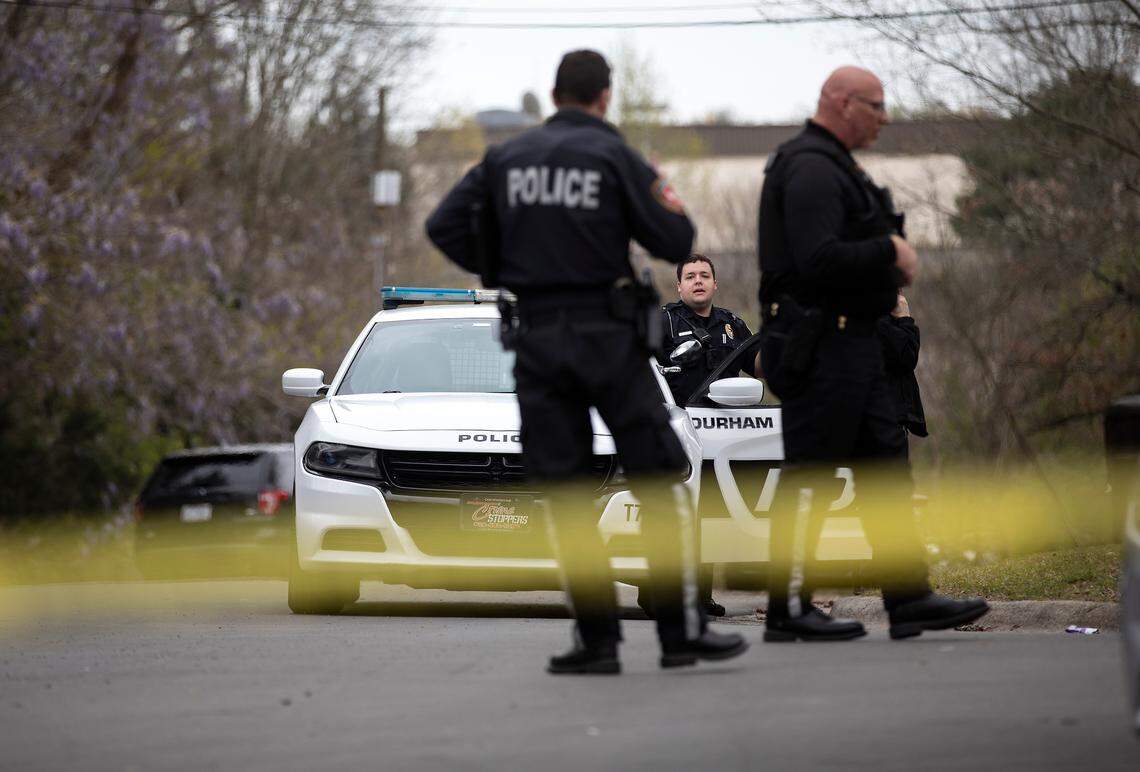 Law enforcement investigate a homicide near the intersection of Hudson Avenue and North Buchanan Boulevard on Wednesday, March 22, 2023, in Durham, N.C.