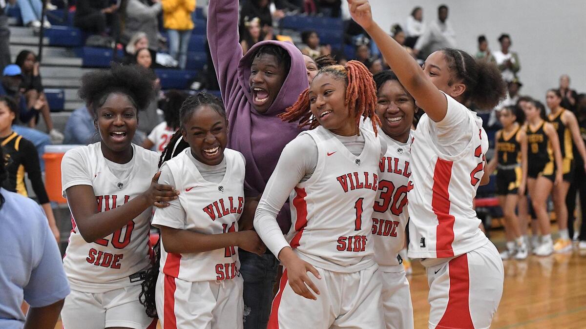 Rolesville’s Taliya Rowe (1) and her teammates celebrate after defeating Chapel Hill in the quarterfinal playoff game. Chapel Hill and Rolesville met in a NCHSAA 4A quarterfinal playoff game in Raleigh, N.C. on March 8, 2024.