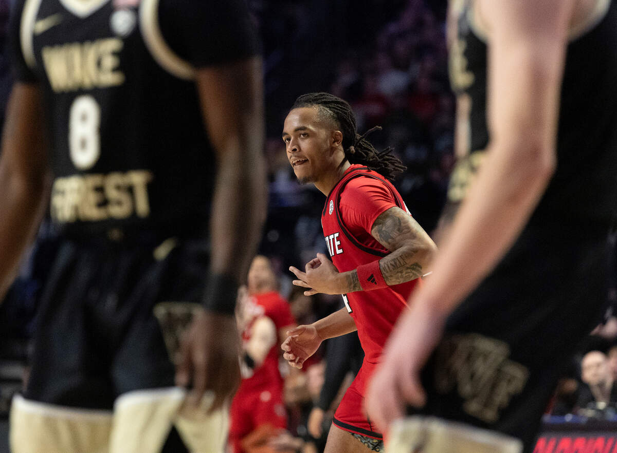 N.C. State’s Breon Pass reacts after knocking down a three-point basket during the first half of the Wolfpack’s 77-59 loss to Wake Forest on Saturday, Jan. 4, 2025, at Lawrence Joel Veterans Memorial Coliseum in Winston-Salem, N.C.