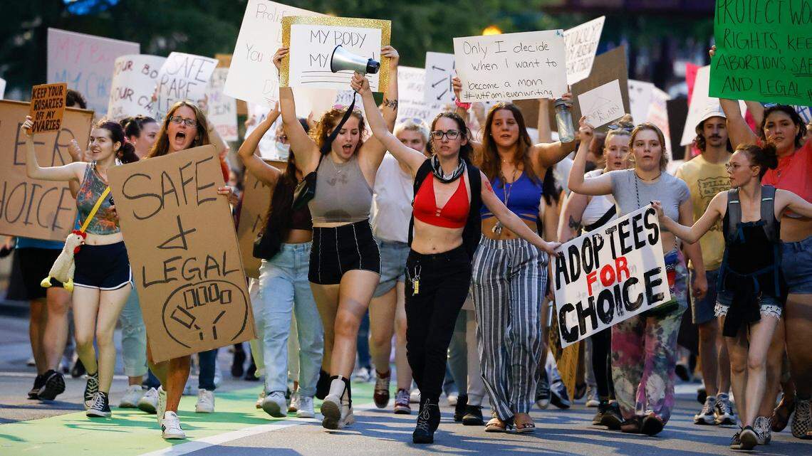 Abortion rights activists march along East Fourth Street in Charlotte, N.C., Sunday, June 26, 2022. The demonstration was in response to the U.S. Supreme Court’s decision to overturn Roe v. Wade.