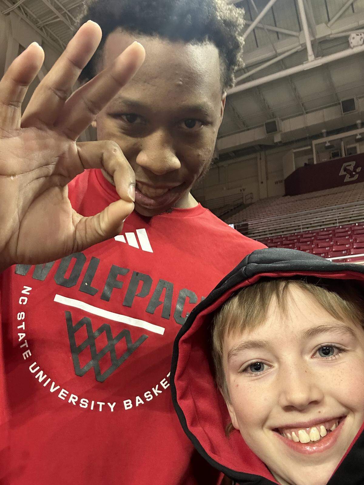 N.C. State’s Quadir Copeland takes a selfie with Finley Hall ahead of the Wolfpack’s men’s basketball game at Boston College on Jan. 6, 2026, in Chestnut Hill, Mass.