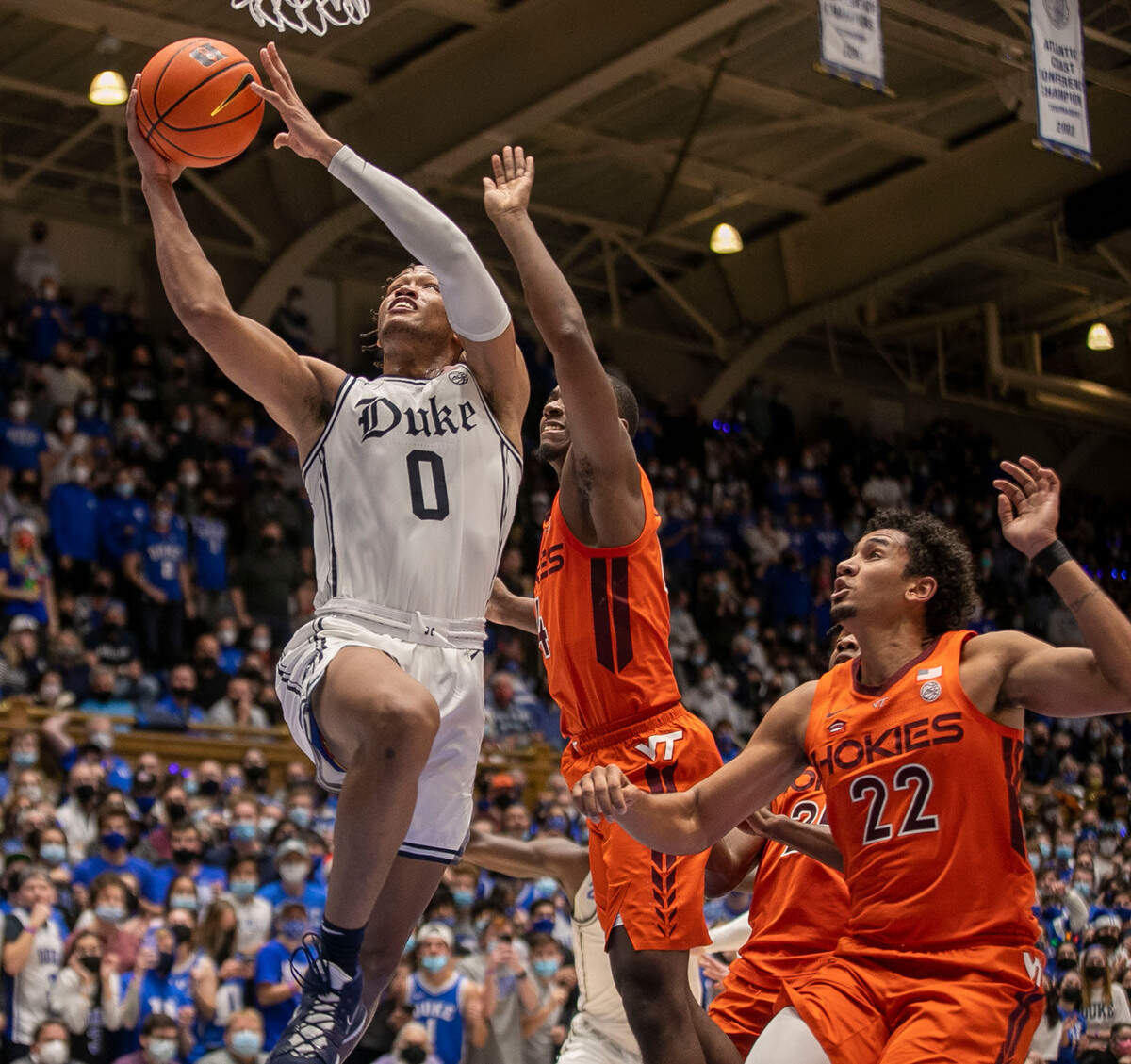 Duke’s Wendell Moore Jr. (0) drives to the basket in the second half against Virginia Tech’s Nahiem Alleyne (4) and Keve Aluma (22) on Wednesday, December 22, 2021 at Cameron Indoor Stadium in Durham, N.C.