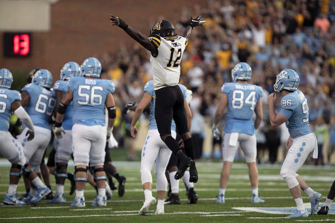 Appalachian State’s Steven Jones (12) celebrates after North Carolina kicker Noah Ruggles (97) missed a 56-yard field goal to give Appalachian State a 34-31 victory over North Carolina on Saturday, September 21, 2019 at Kenan Stadium in Chapel Hill, N.C.