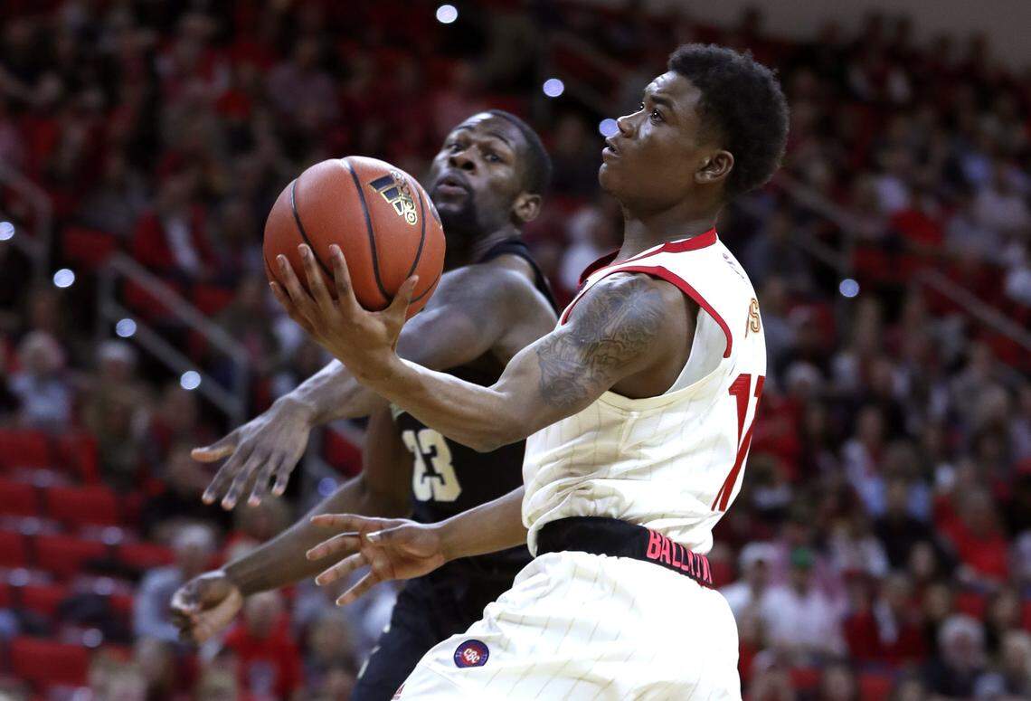 N.C. State’s Markell Johnson (11) drives to the basket past Wake Forest’s Chaundee Brown (23) during the first half of N.C. State’s game against Wake Forest at PNC Arena in Raleigh, N.C., Sunday, Feb. 24, 2019.