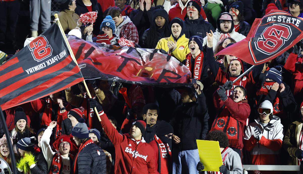 Wolfpack fans cheer on N.C. State before their game against Washington in the 2025 Men’s Soccer National Championship at WakeMed Soccer Park in Cary, N.C., Monday, Dec. 15, 2025.