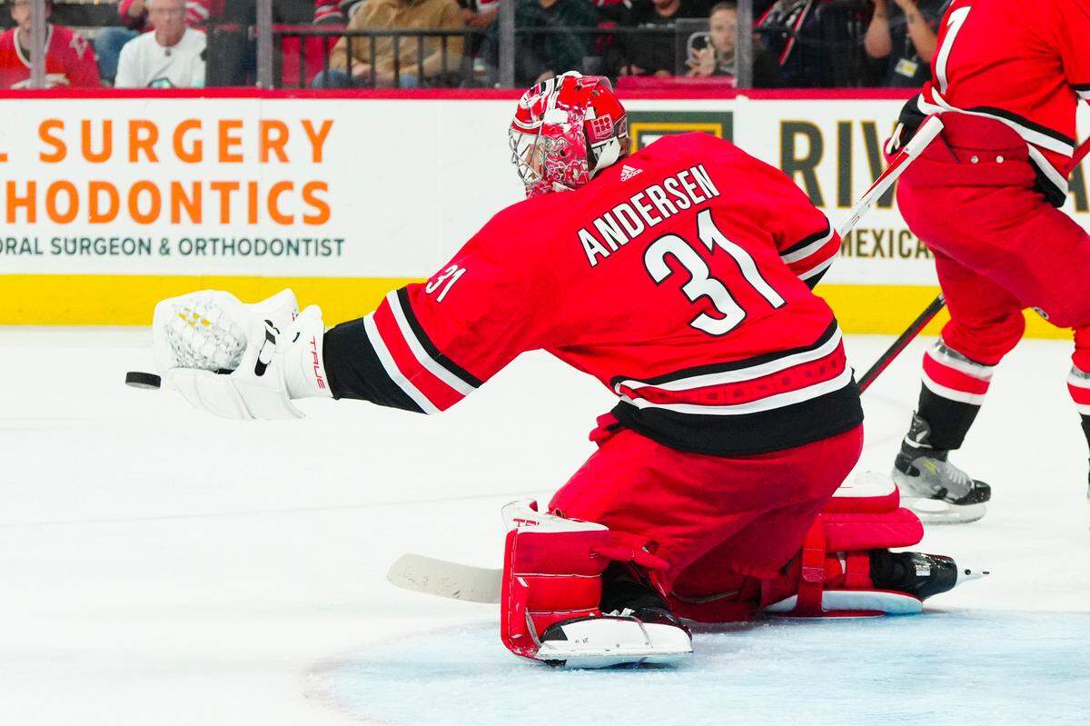 Oct 26, 2023; Raleigh, North Carolina, USA; Carolina Hurricanes goaltender Frederik Andersen (31) reaches out to make glove save against the Seattle Kraken during the second period at PNC Arena.