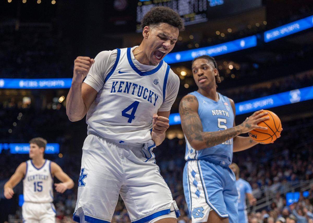Kentucky’s Tre Mitchell (4) reacts after drawing a foul from North Carolina’s Armando Bacot (5) in the second half on Saturday, December 16, 2023 at State Farm Arena in Atlanta, Georgia.