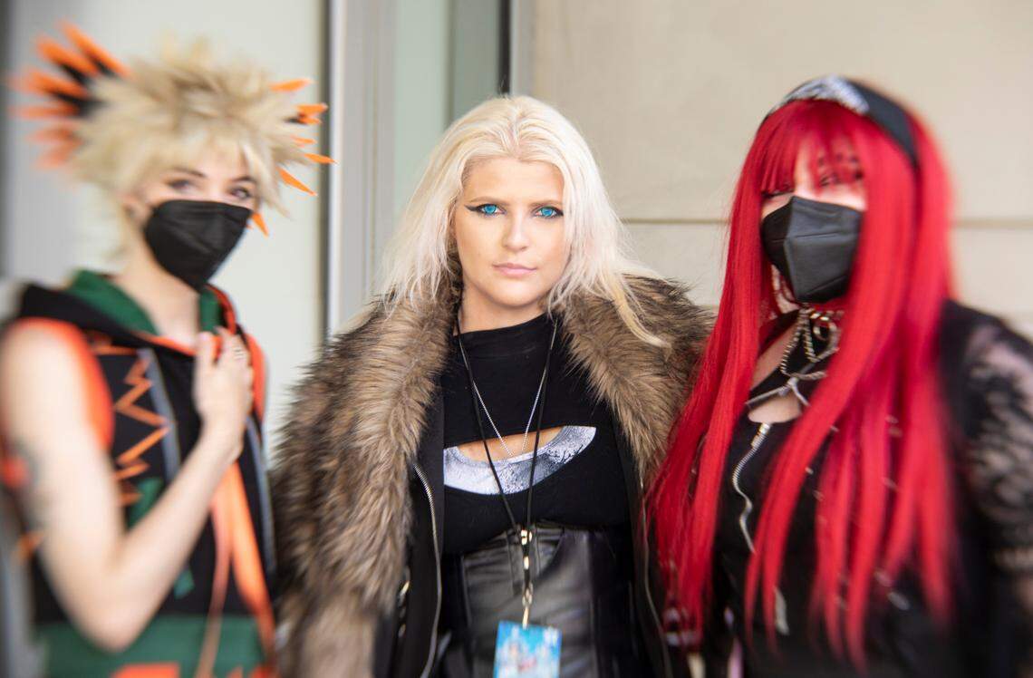 Attendees of GalaxyCon Raleigh pose for a portrait before heading into the Convention Center Friday afternoon, July 28, 2023.