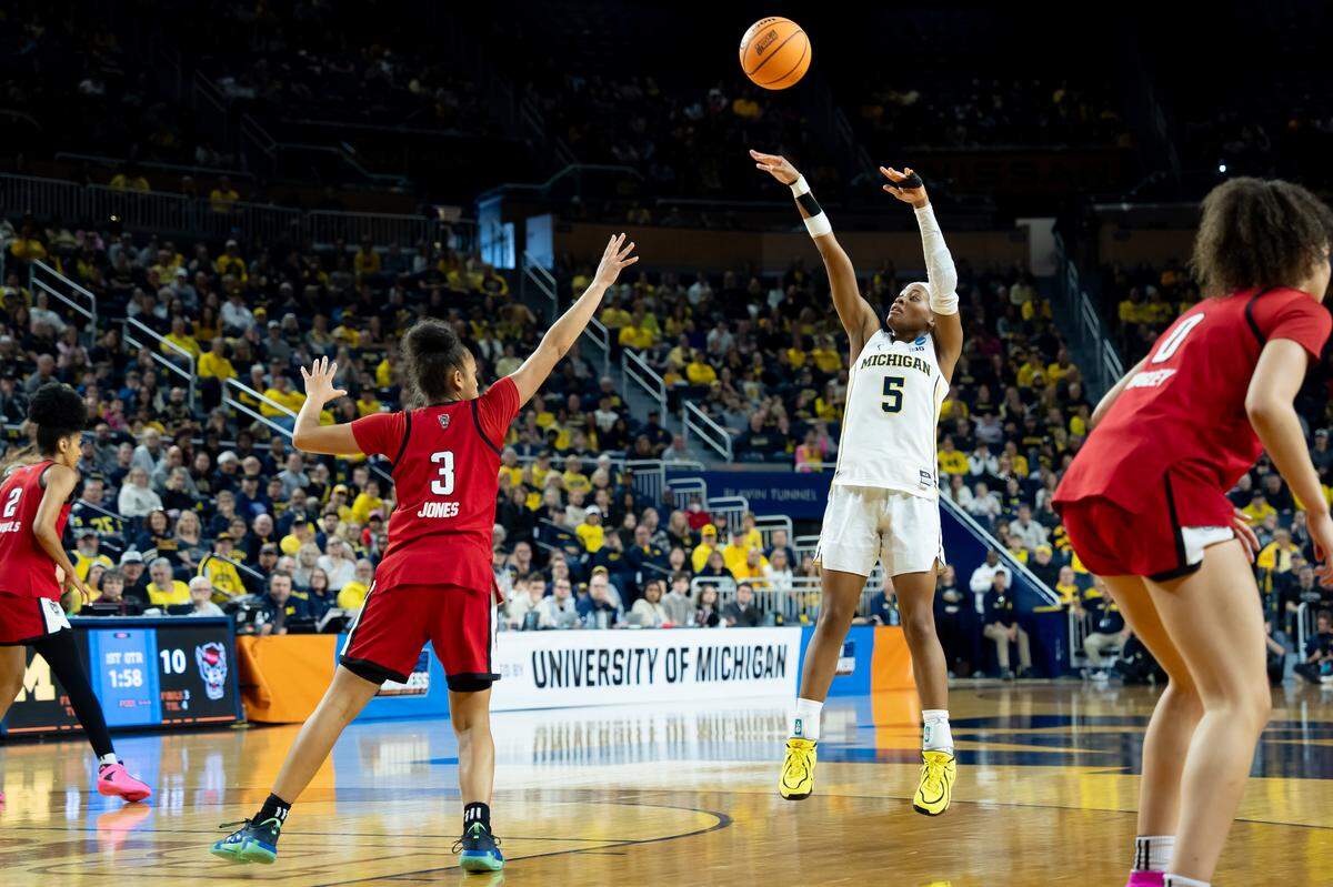 Michigan’s Brooke Quarles Daniels (5) shoots the ball against Zamareya Jones (3) of N.C. State during the teams’ NCAA Women’s Basketball Tournament Round of 32 game at Crisler Arena on March 22, 2026 in Ann Arbor, Michigan.