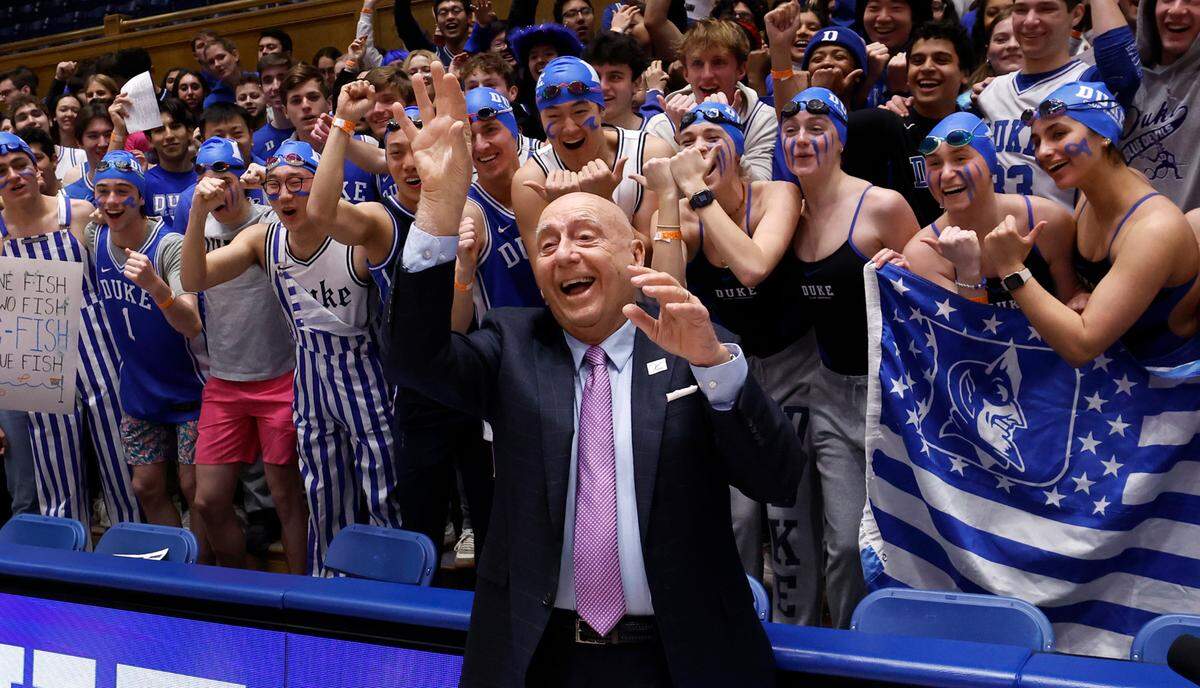 ESPN college basketball analyst Dick Vitale poses with Cameron Crazies before Duke’s game against Stanford at Cameron Indoor Stadium in Durham, N.C., Saturday, Feb. 15, 2025.