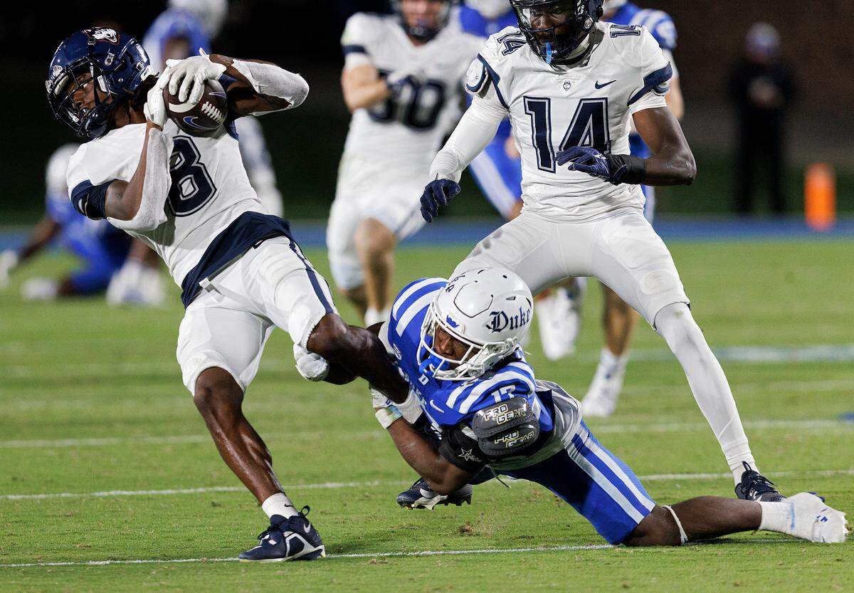 Duke’s Vontae Floyd tackles Connecticut’s TJ Sheffield during the second half of the Blue Devils’ 26-21 win on Saturday, Sept. 14, 2024, at Wallace Wade Stadium in Durham, N.C.