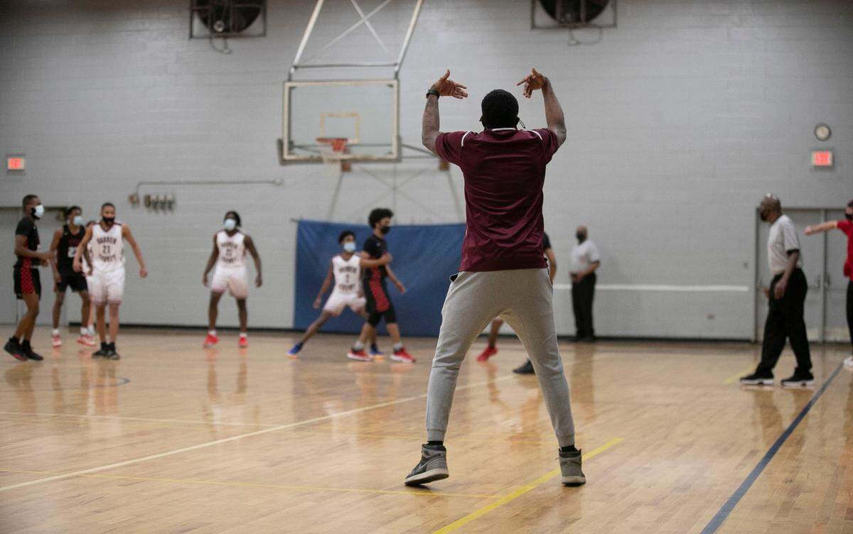 Warren County High School coach Toriano McRae Jr. directs his team of defense during the third quarter against Webb High School on Friday, January 29, 2021 in Warrenton, N.C.