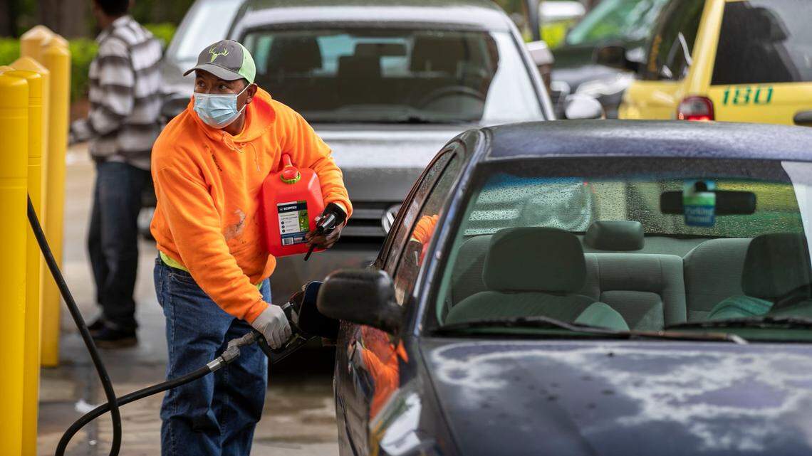 Customers fill up their automobiles and gas containers with fuel at the Circle K on Wednesday, May 12, 2021 in Raleigh, N.C.