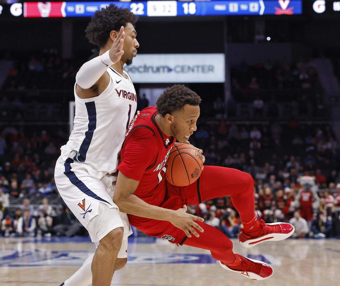 N.C. State's Quadir Copeland drives against Virginia's Malik Thomas during the first half of the Wolfpack’s ACC Tournament quarterfinal game onThursday, March 12, 2026, at the Spectrum Center in Charlotte, N.C. 