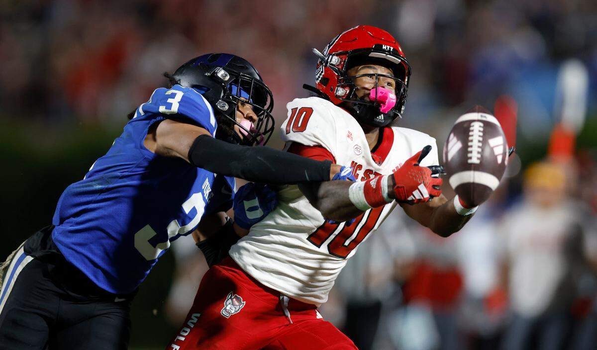 N.C. State wide receiver KC Concepcion (10) can’t pull in the reception while being defended by Duke’s Brandon Johnson (3) during the second half of Duke’s 24-3 victory over N.C. State at Wallace Wade Stadium in Durham, N.C., Saturday, Oct. 14, 2023.