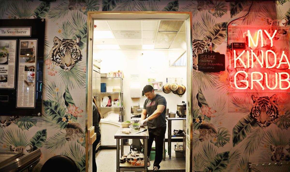 MKG owner Toan To works in the kitchen at Morgan Street Food Hall in downtown Raleigh on Tuesday, March 5, 2019.