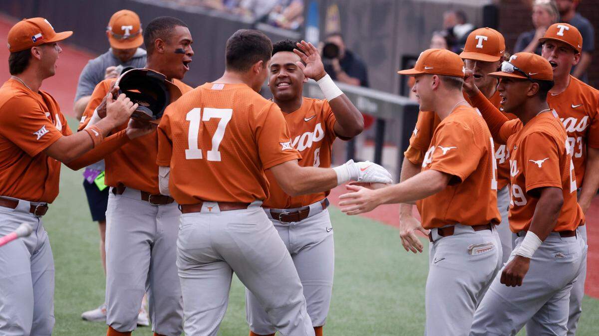 Texas’ Ivan Melendez (17) is congratulated by teammates after hitting a three-run home run in the first inning during ECU’s game against Texas in the Greenville Super Regional at Clark-LeClair Stadium Sunday, June 12, 2022.