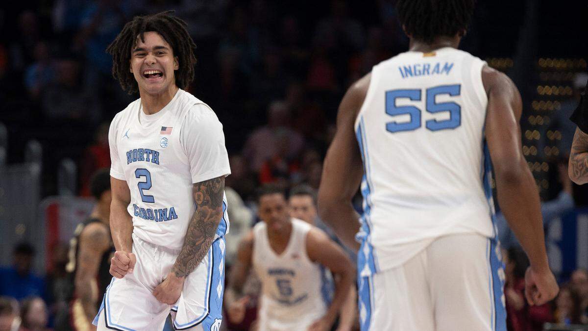 North Carolina’s Elliot Cadeau (2) reacts as the Tar Heels take a 46-27 lead over Florida State in the first half in the quarterfinals of the ACC Men’s Basketball Tournament at Capitol One Arena on Wednesday, March 13, 2024 in Washington, D.C.