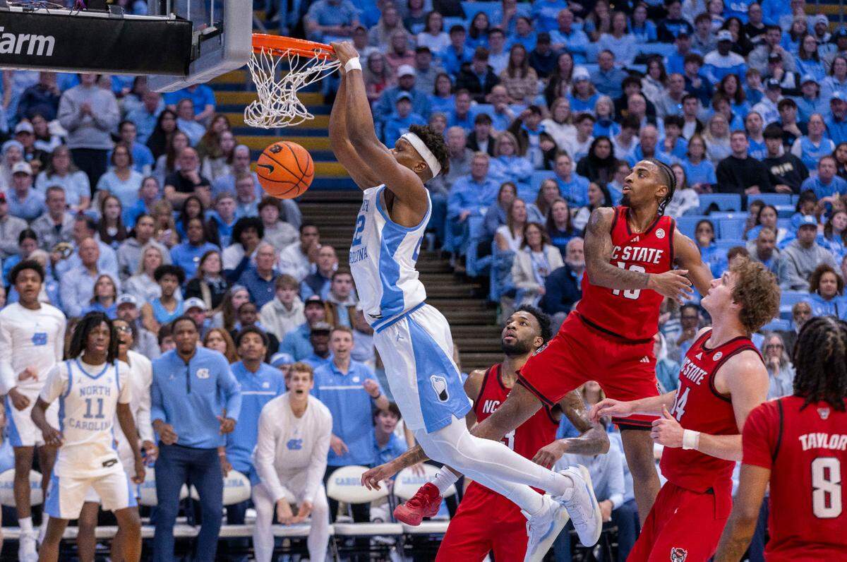North Carolina forward Ven-Allen Lubin (22) breaks to the basket for a dunk against N.C. State guard Marcus Hill Jr. (10) in the second half on Wednesday, February 19, 2025 in Chapel Hill, N.C.