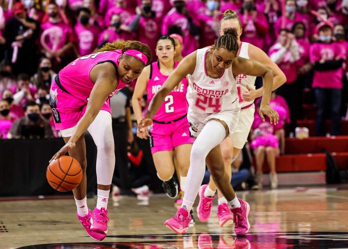 N.C. State’s Kayla Jones (25) steals the ball from Georgia Tech’s Eylia Love (24) during the second half of N.C. States game against Georgia Tech Monday, Feb. 7, 2022 at Reynolds Coliseum in Raleigh. N.C..State beat Georgia Tech 59-48.