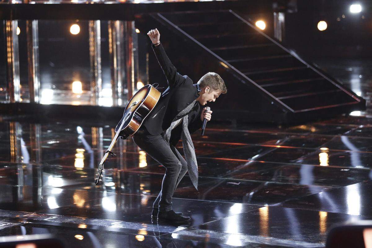 Britton Buchanan performs as a Top 12 contestant on NBC's "The Voice" on April 23, 2018.