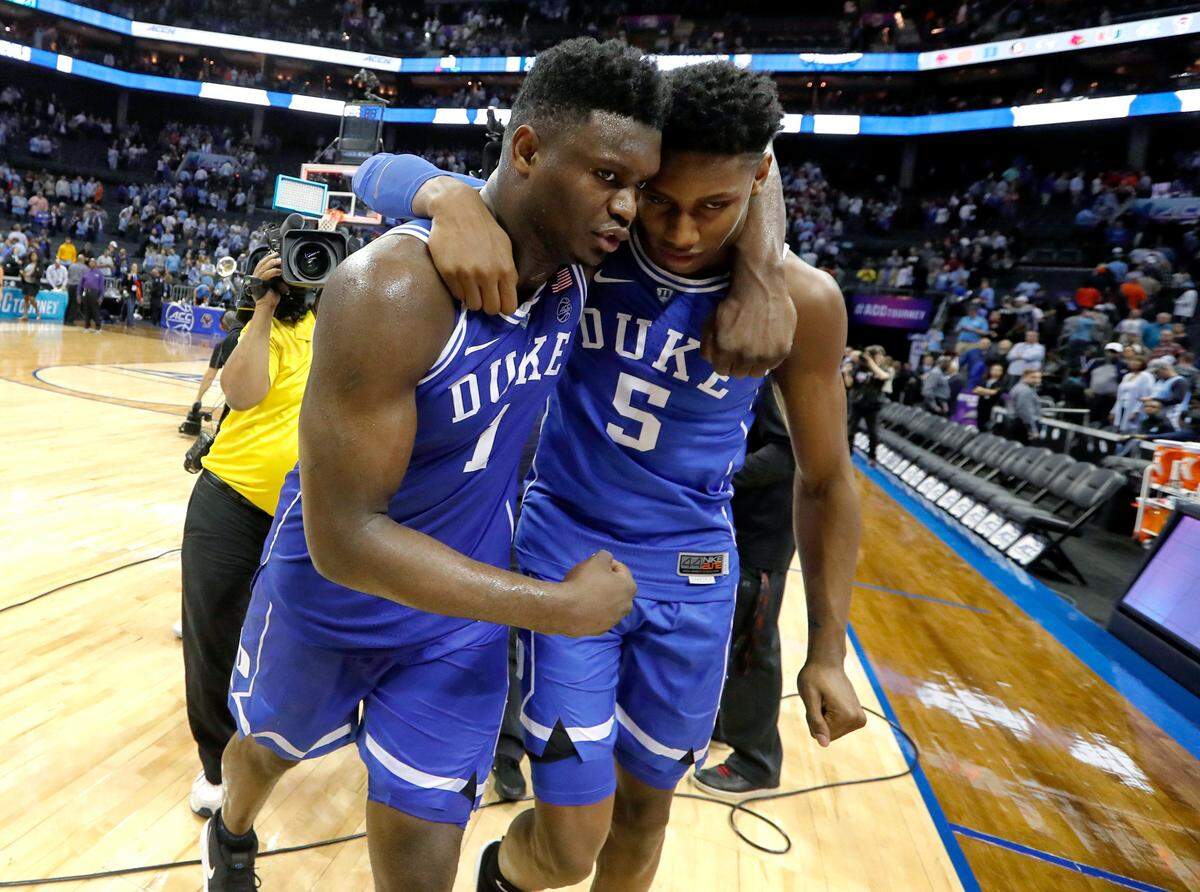Duke’s Zion Williamson (1) walks off the court with RJ Barrett (5) after Duke’s 74-73 victory over UNC in the semifinals of the 2019 ACC Tournament in Charlotte, N.C., Friday, March 15, 2019.