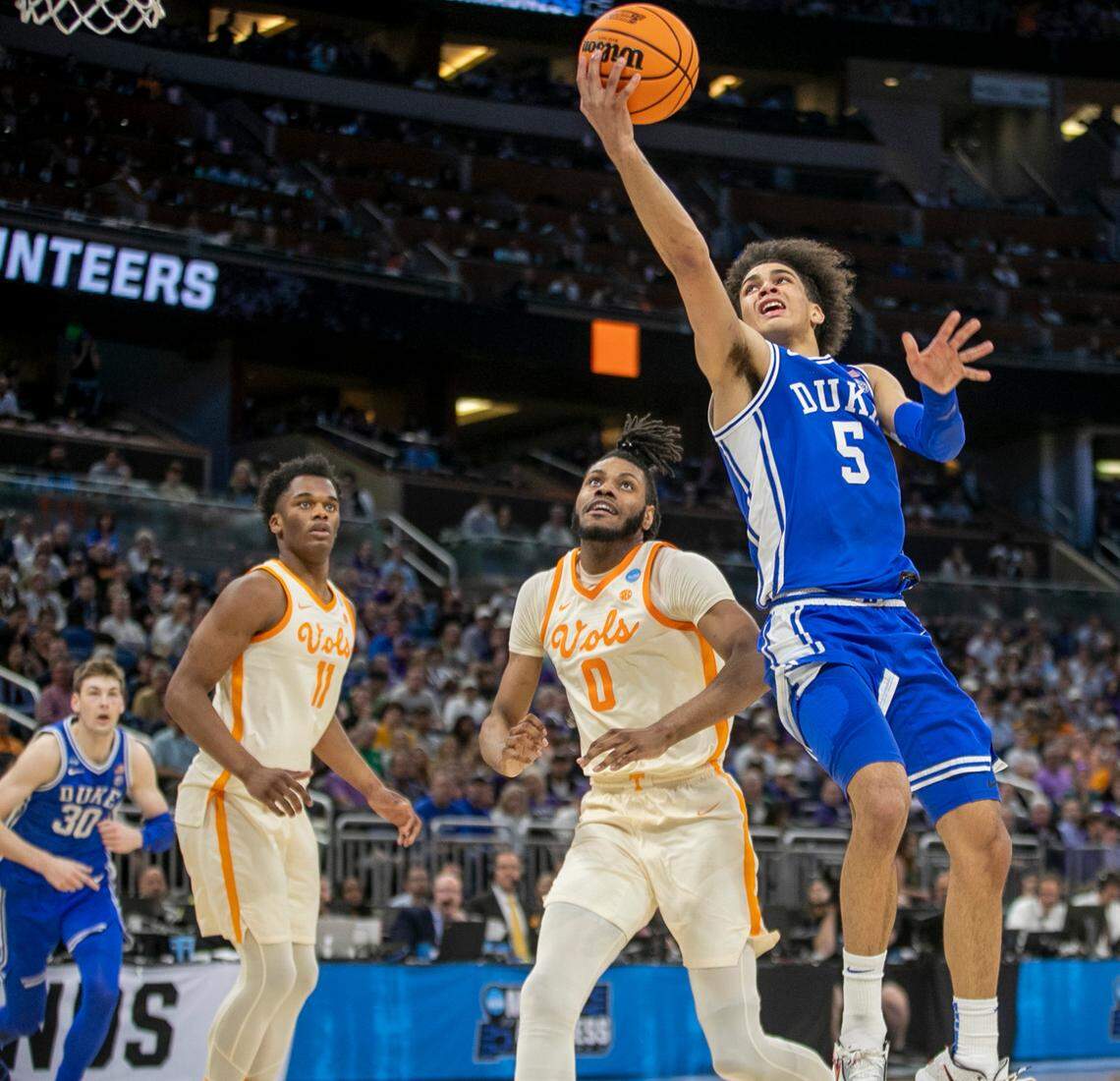 Duke’s Tyrese Proctor (5) drives to the basket against Tennessee’s Jonas Aidoo (0) during the second half in the second round of the NCAA Tournament on Saturday, March 18, 2023 at the Amway Center in Orlando, Fla. Proctor lead Duke with 16 points in their 65-52 loss.