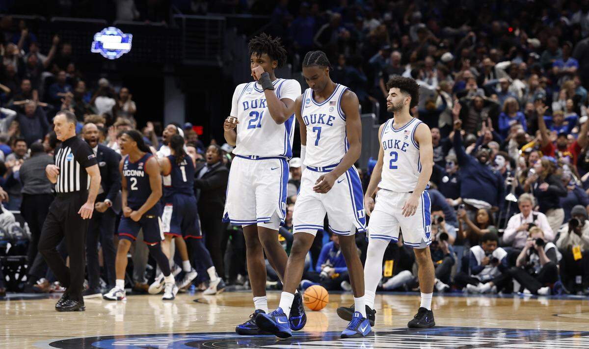 Duke’s Patrick Ngongba II (21), Dame Sarr (7) and Cayden Boozer (2) walk to the bench after UConn’s Braylon Mullins made a three-pointer in the final seconds of UConn’s 73-72 victory over Duke in the NCAA Men’s Tournament East Regional Final at Capital One Arena in Washington, D.C., Sunday, March 29, 2026.