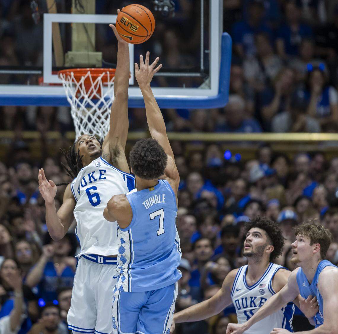 Duke forward Maliq Brown (6) blocks a shot by North Carolina guard Seth Trimble (7) in the first half on Saturday, March 7, 2026 at Cameron Indoor Stadium in Durham, N.C.