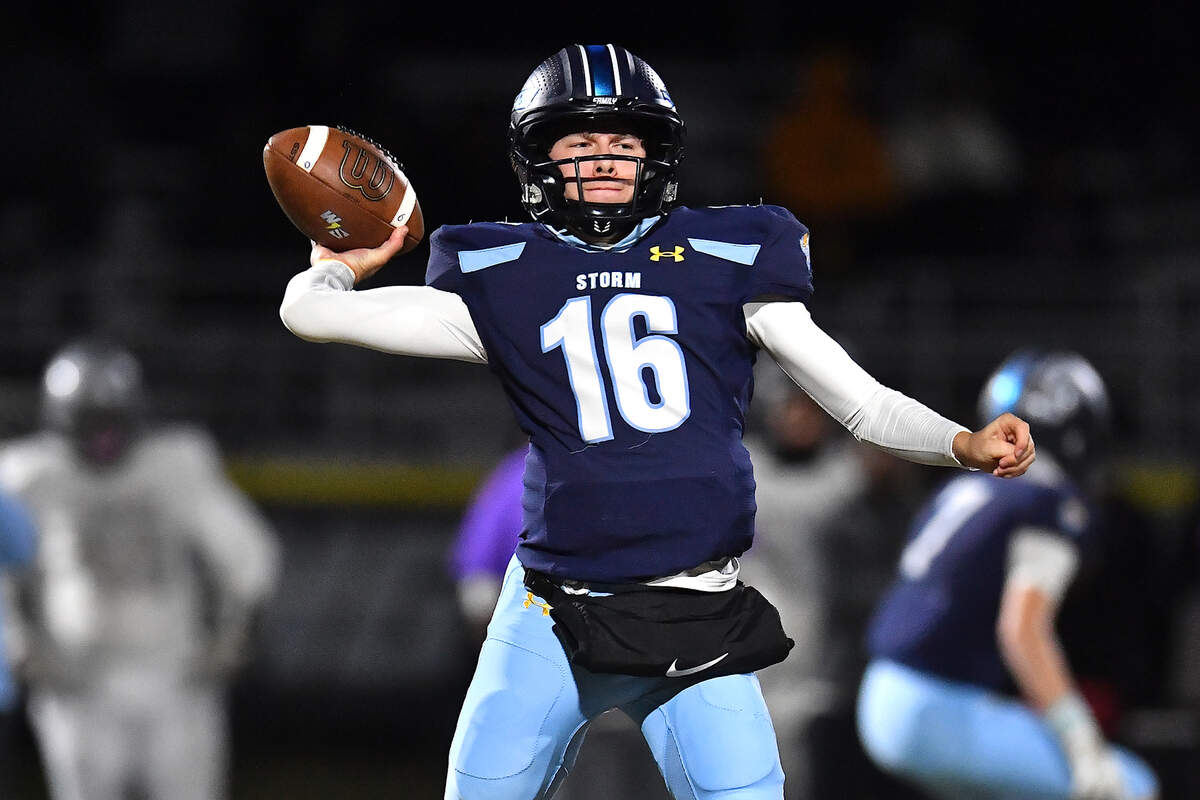 South Garner quarterback Justin Bourne (16) looks to pass downfield against South Garner during the first half. The Willow Spring Storm and the South Garner Titans met in a football game in Fuquay-Varina. N.C. on October 18, 2024.