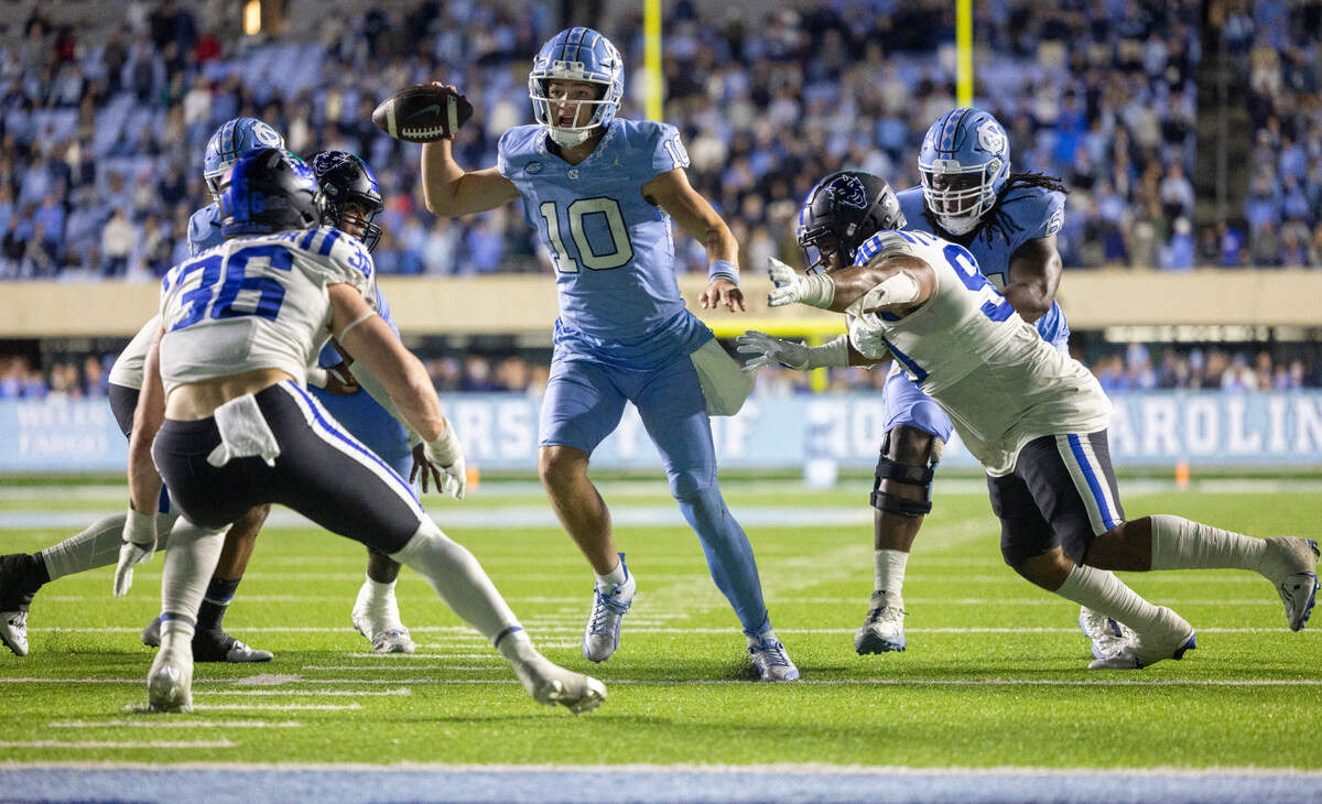 North Carolina quarterback Drake Maye (10) pass to receiver John Copenhaver on a two point conversion in the second over time to give the Tar Heels a 47-39 lead on Saturday, Nov. 11, 2023 at Kenan Stadium in Chapel Hill, N.C.